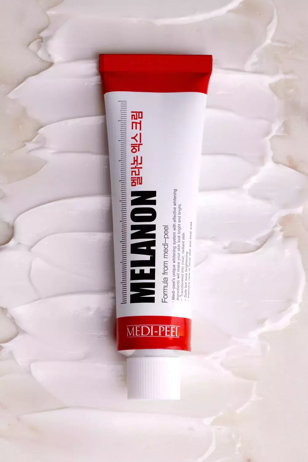 Crema despigmentante Medipeel Melanon para combatir hiperpigmentación localizada.