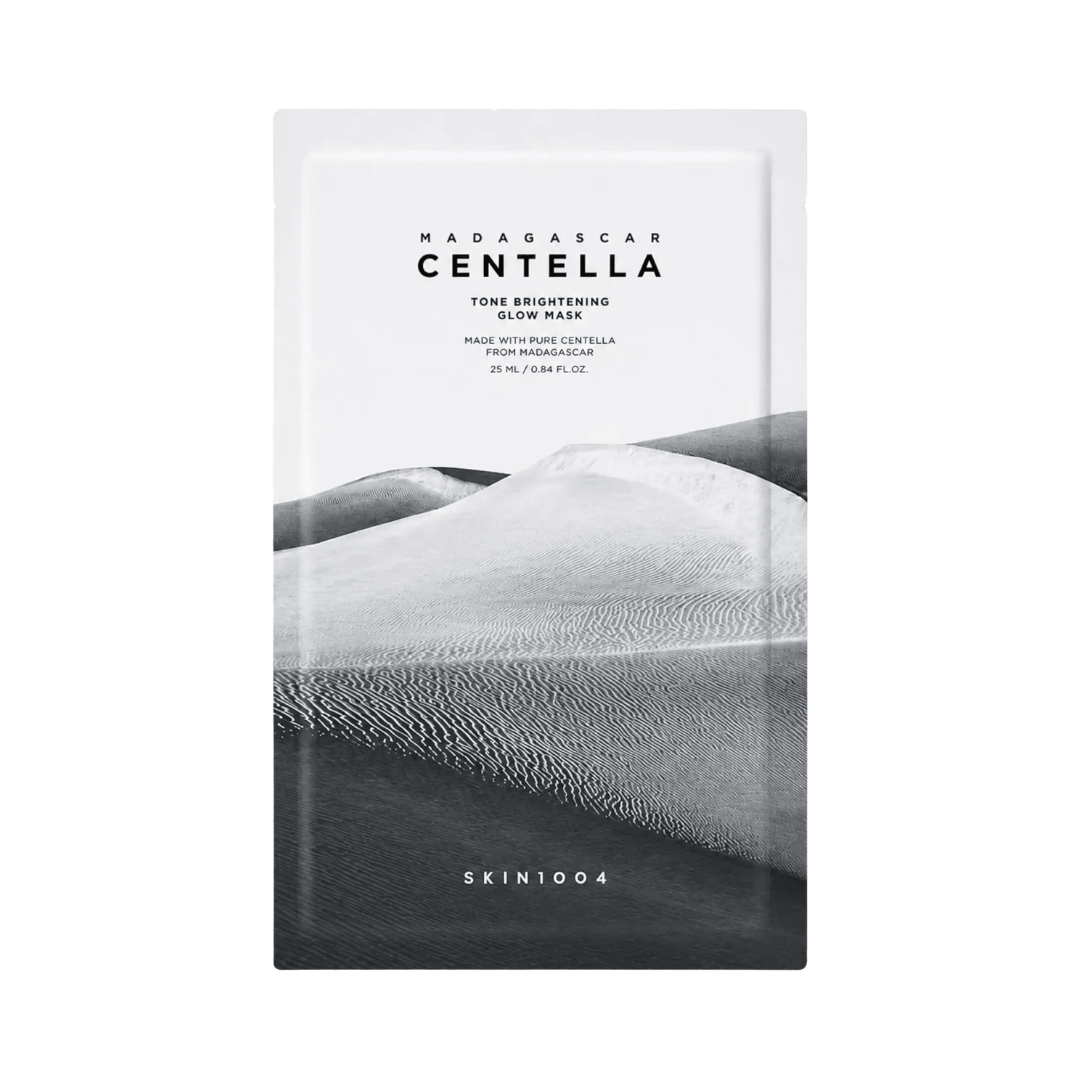 Mascarilla facial SKIN1004 Madagascar Centella Tone Brightening Glow Mask con centella asiática que ayuda a calmar, hidratar e iluminar la piel para un tono más uniforme.